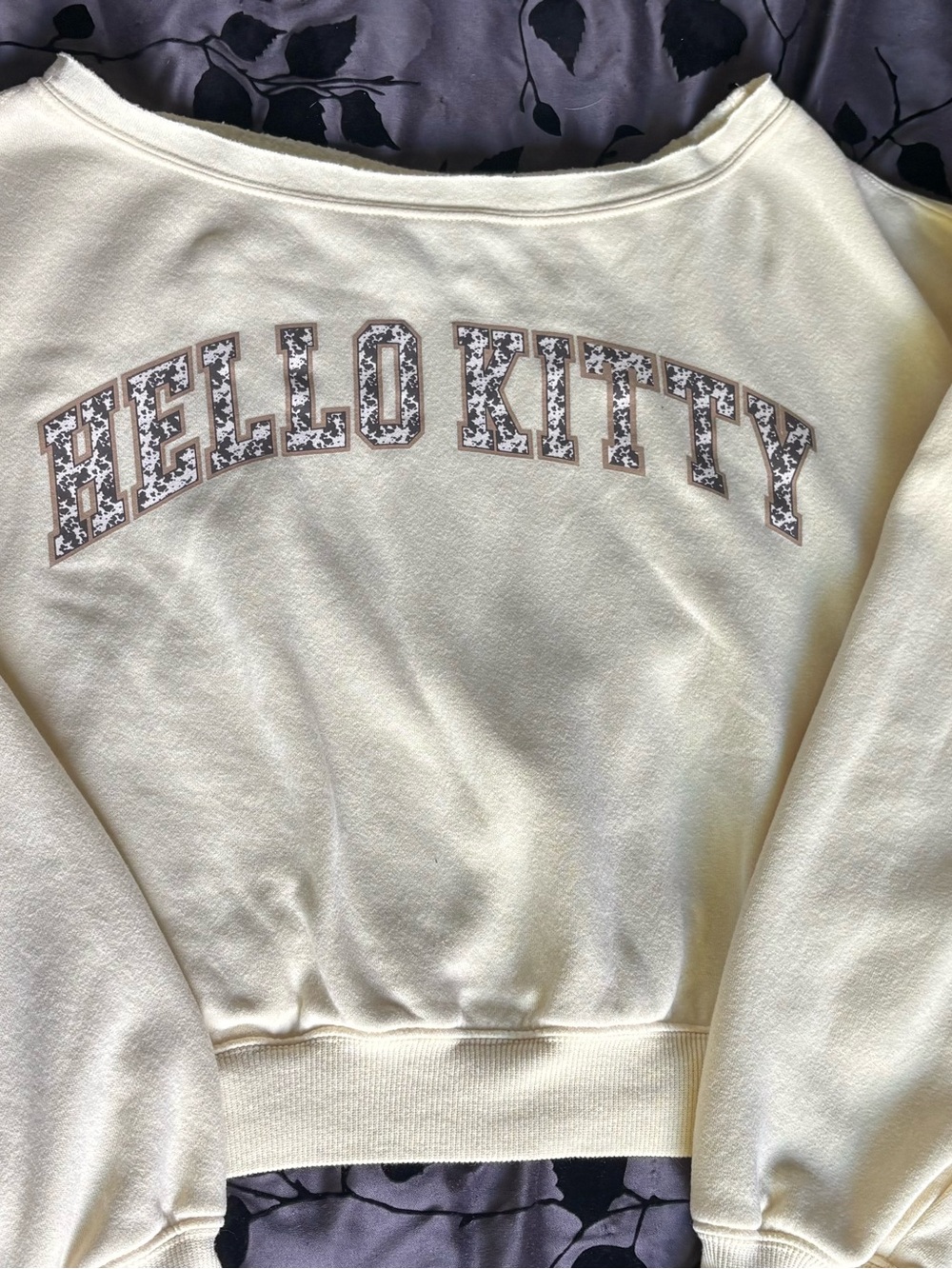 Hello Kitty Cream Off-Shoulder Sweatshirt with Patterned Lettering